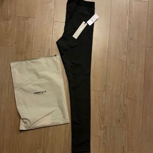 Stretch jersey leggings in black. High-rise. Tonal logo printed at leg.